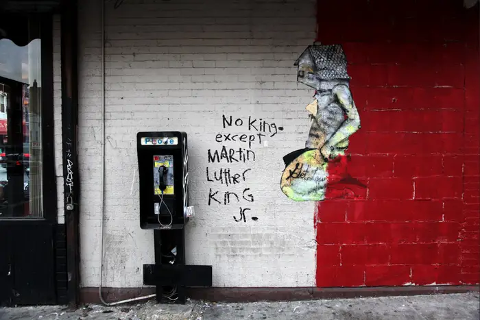 A photo of graffiti that says "No King. Except Martin Luther King Jr."
